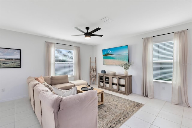 tiled living room featuring ceiling fan