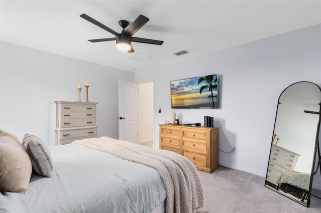 bedroom featuring light colored carpet and ceiling fan