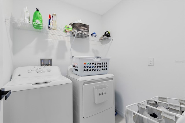 washroom featuring washer and dryer