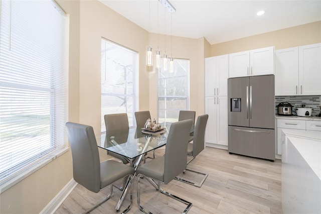 dining room featuring light wood-type flooring