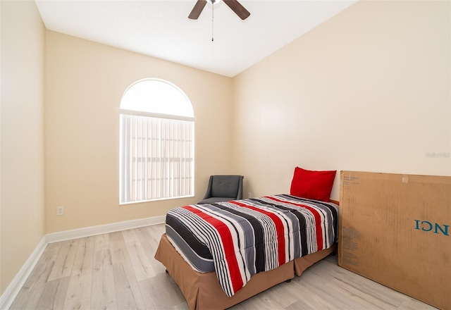 bedroom with light hardwood / wood-style floors and ceiling fan