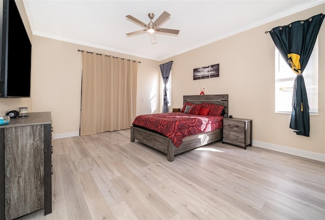 bedroom with crown molding, ceiling fan, and light hardwood / wood-style flooring