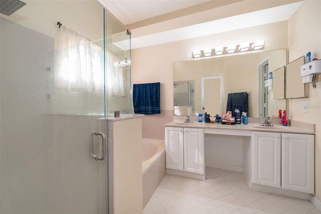 bathroom with vanity and separate shower and tub