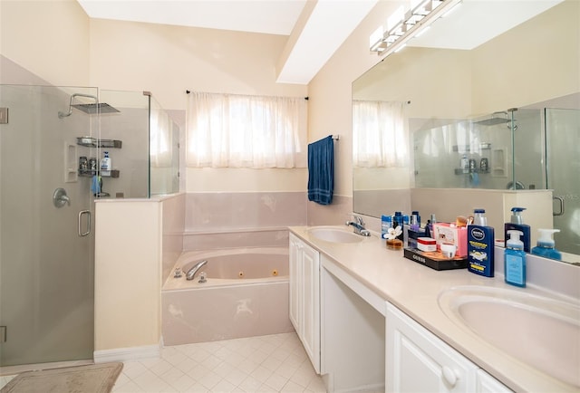 bathroom with tile patterned floors, independent shower and bath, and vanity