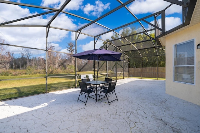 view of patio with glass enclosure