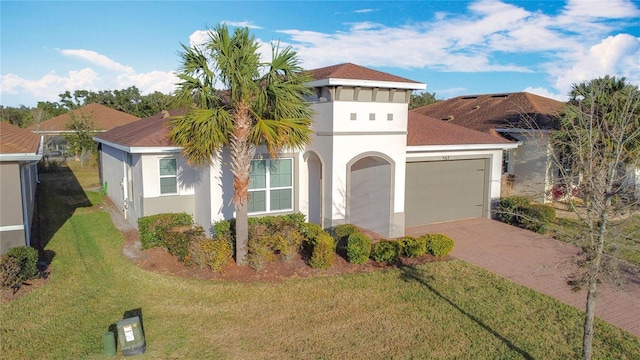 view of front of house featuring a garage and a front yard