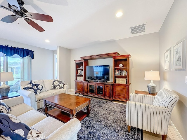 tiled living room featuring ceiling fan