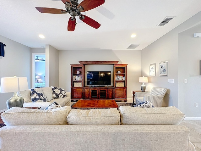 tiled living room with ceiling fan