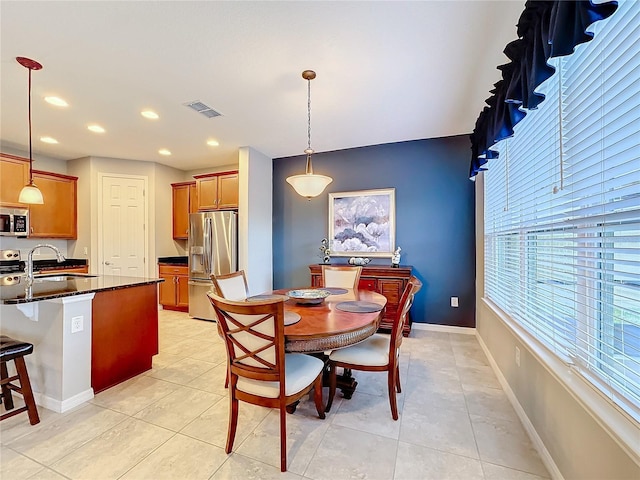 tiled dining space with sink