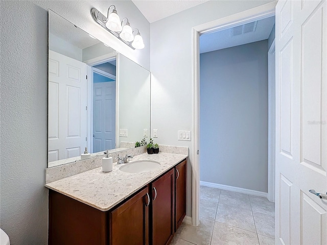 bathroom with vanity and tile patterned flooring