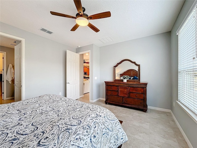 bedroom with ceiling fan, multiple windows, and a textured ceiling