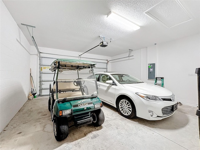 garage featuring a garage door opener and electric panel