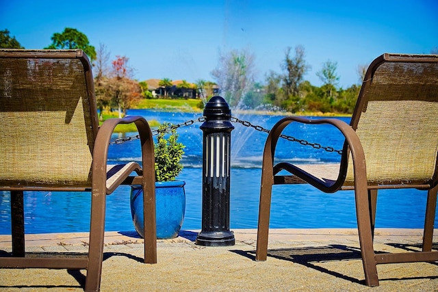 view of play area with a water view