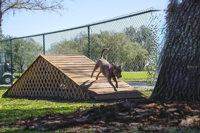 view of community with fence