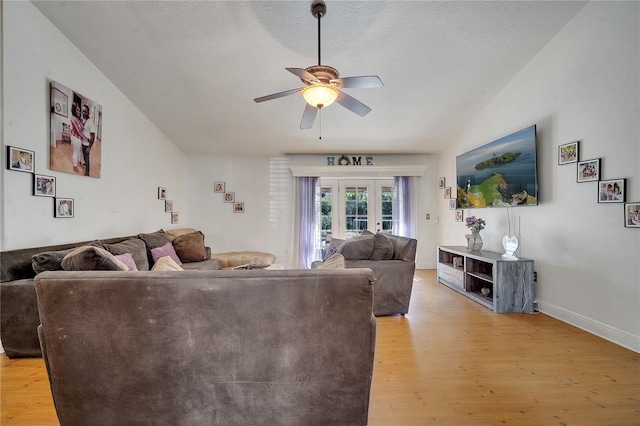 2417 Liela Lee Ct, Ocoee, FL 34761 - living room featuring a textured ceiling, light hardwood / wood-style floors, french doors, and ceiling fan