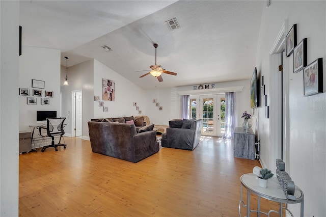 2417 Liela Lee Ct, Ocoee, FL 34761 - living room featuring french doors, ceiling fan, lofted ceiling, and light hardwood / wood-style flooring