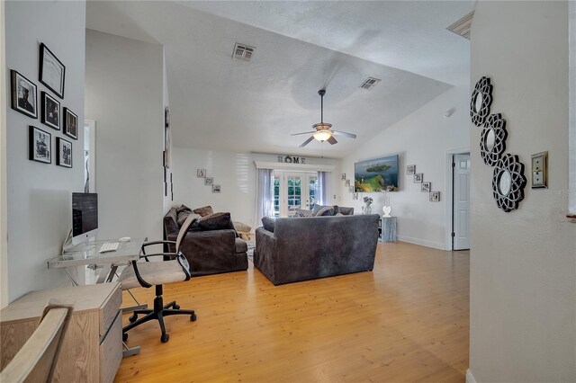 2417 Liela Lee Ct, Ocoee, FL 34761 - living room featuring lofted ceiling, a textured ceiling, light hardwood / wood-style floors, and ceiling fan
