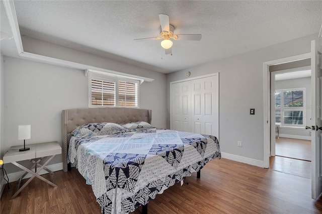2417 Liela Lee Ct, Ocoee, FL 34761 - bedroom featuring ceiling fan, hardwood / wood-style floors, a closet, and a textured ceiling