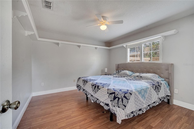 2417 Liela Lee Ct, Ocoee, FL 34761 - bedroom featuring ceiling fan, hardwood / wood-style flooring, and a textured ceiling