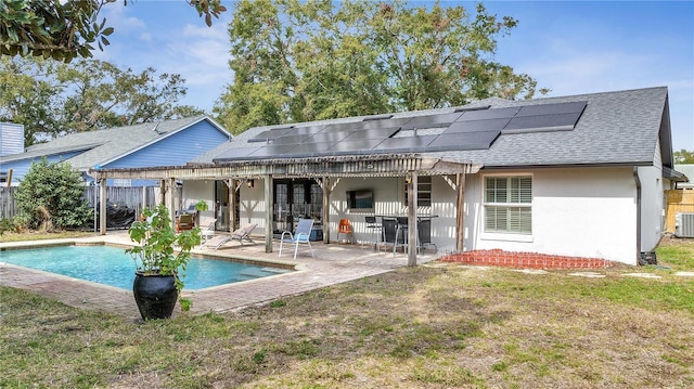 2417 Liela Lee Ct, Ocoee, FL 34761 - rear view of house featuring a fenced in pool, cooling unit, a yard, a patio, and solar panels