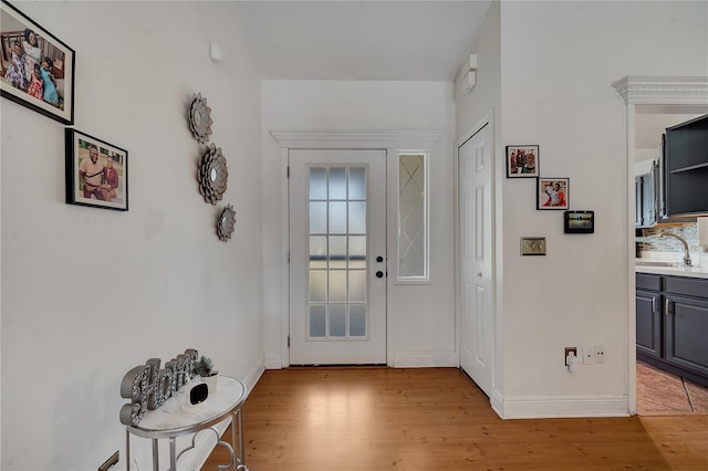 2417 Liela Lee Ct, Ocoee, FL 34761 - foyer entrance with sink and light hardwood / wood-style floors