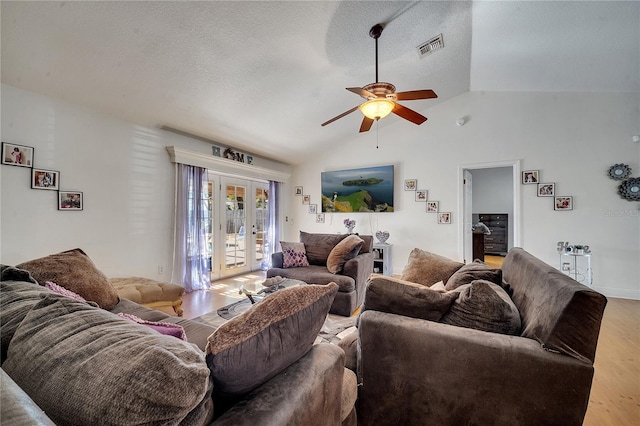2417 Liela Lee Ct, Ocoee, FL 34761 - living room featuring hardwood / wood-style flooring, ceiling fan, a textured ceiling, vaulted ceiling, and french doors