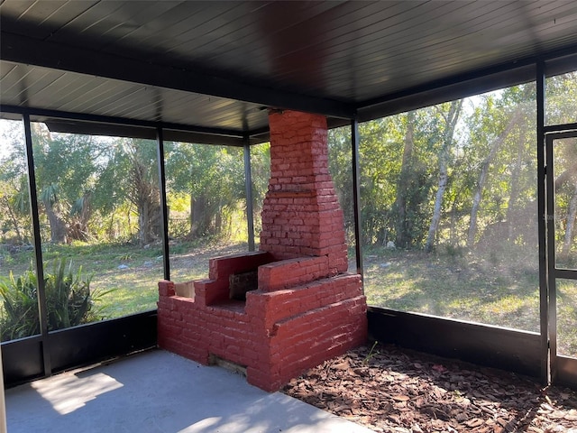 unfurnished sunroom featuring a healthy amount of sunlight