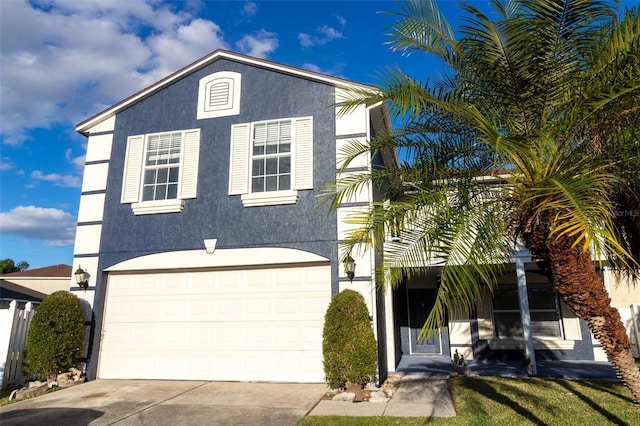 view of front of property with a garage