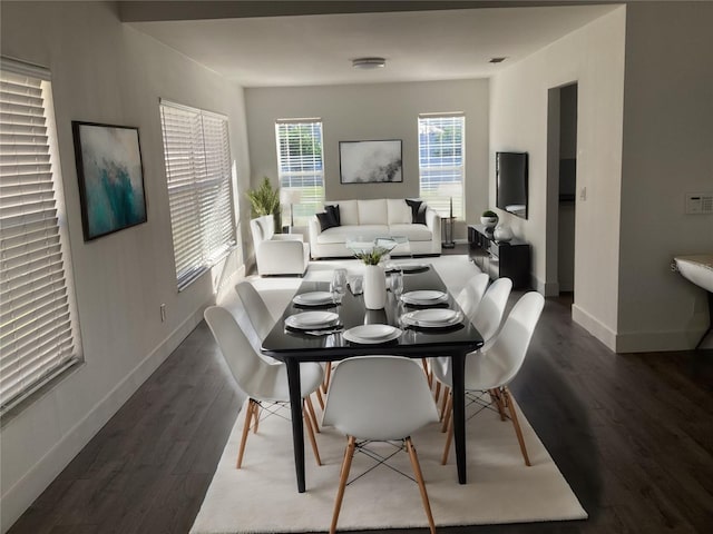 dining room with dark hardwood / wood-style floors