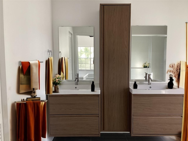 bathroom with vanity and a shower with door