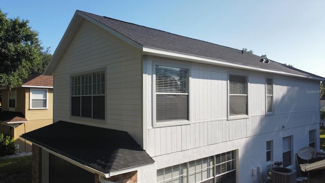 view of side of home with cooling unit