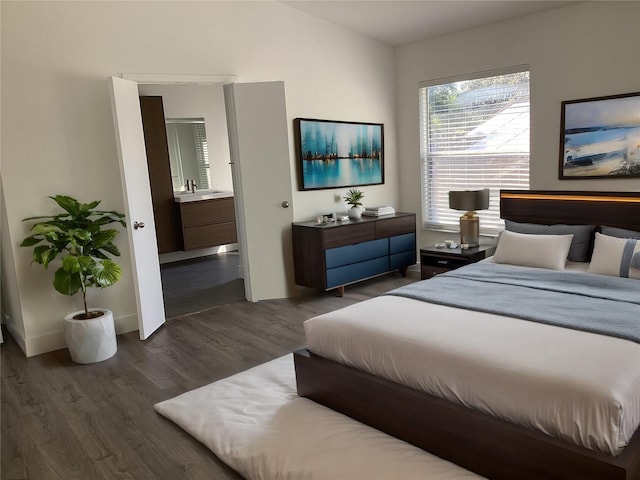 bedroom with lofted ceiling and dark hardwood / wood-style floors