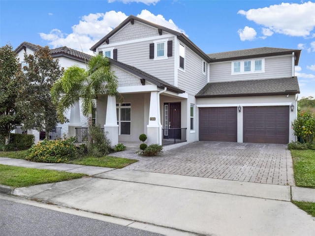 view of front of house with a garage and covered porch