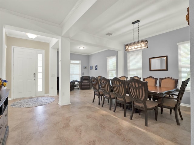 dining space featuring ornamental molding, visible vents, and baseboards