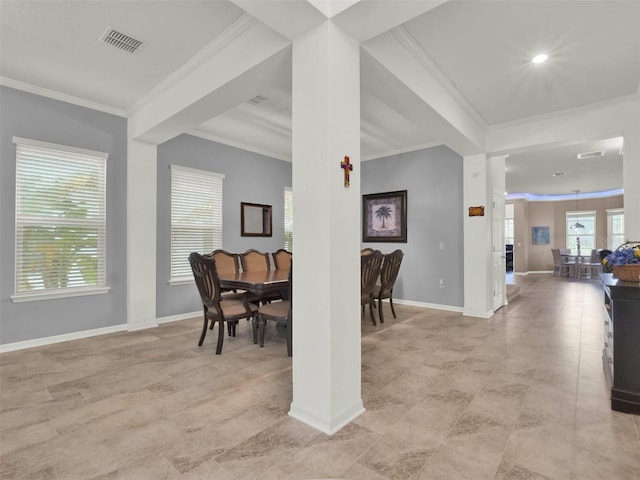 dining area with baseboards, visible vents, and ornamental molding