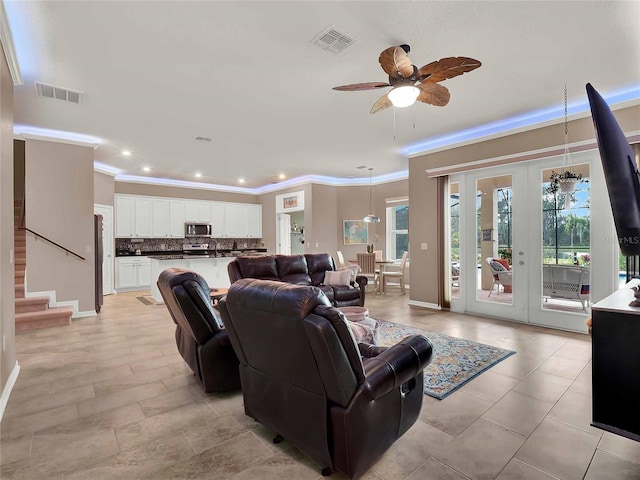 living area with ceiling fan, recessed lighting, visible vents, and crown molding