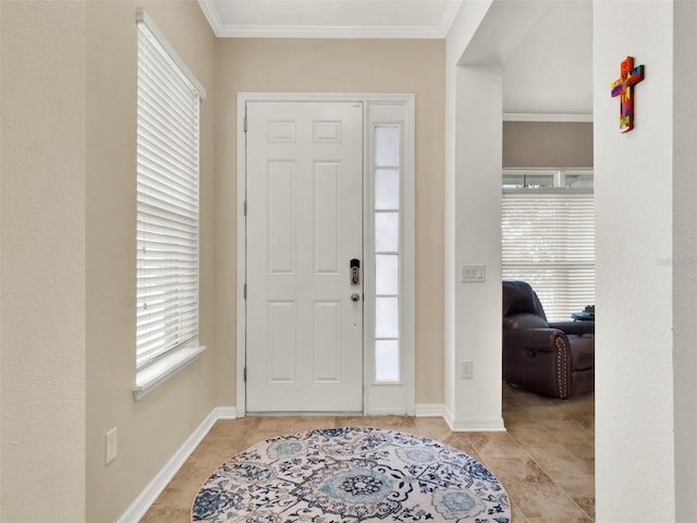 entryway with light tile patterned floors, baseboards, and crown molding