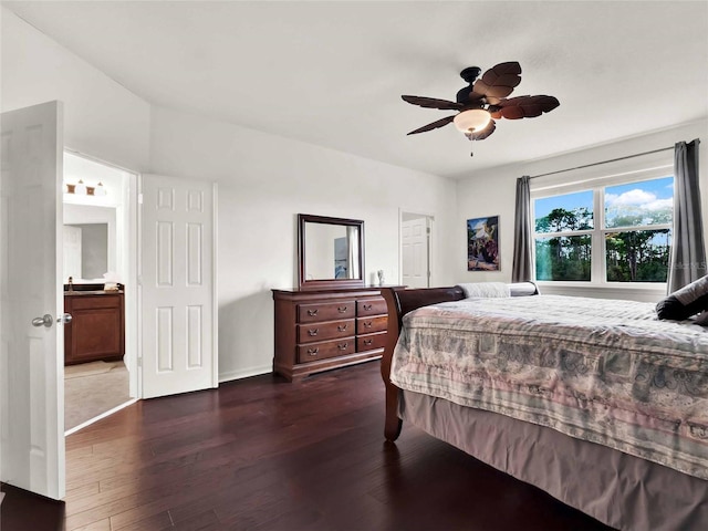 bedroom featuring dark wood-type flooring, a ceiling fan, and baseboards