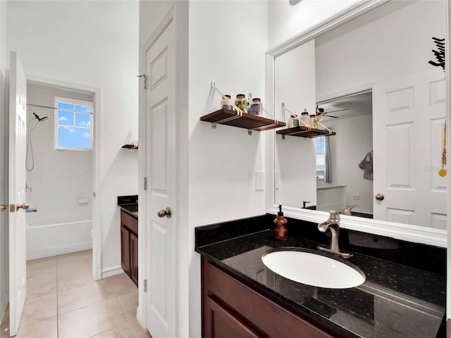 full bathroom featuring tile patterned floors, washtub / shower combination, and vanity