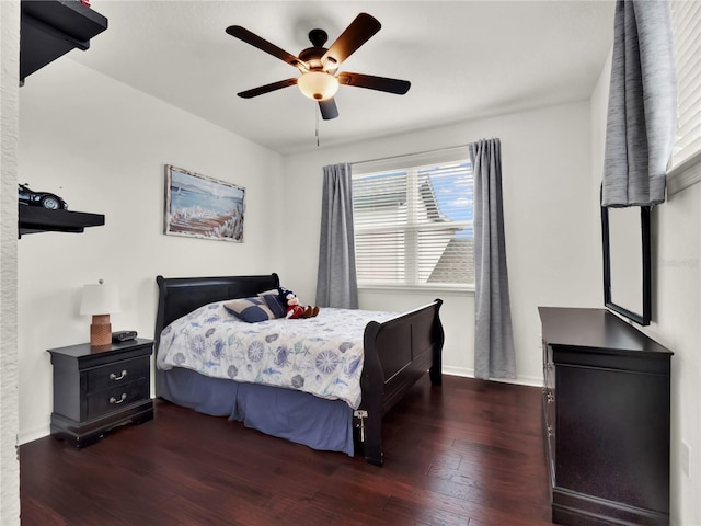 bedroom featuring wood-type flooring, ceiling fan, and baseboards