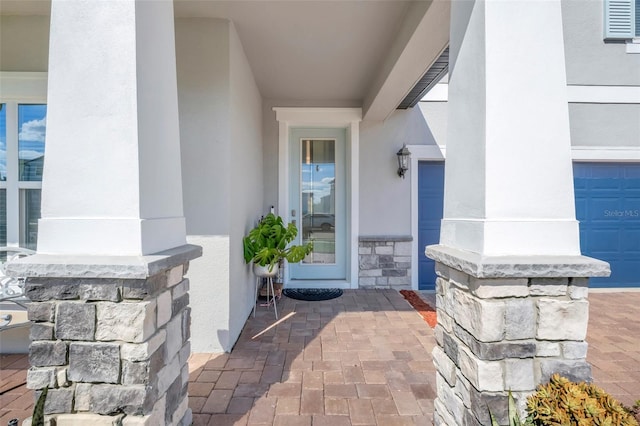 doorway to property featuring a garage