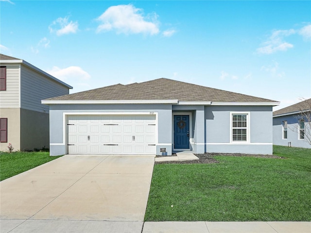 ranch-style house featuring a garage and a front lawn