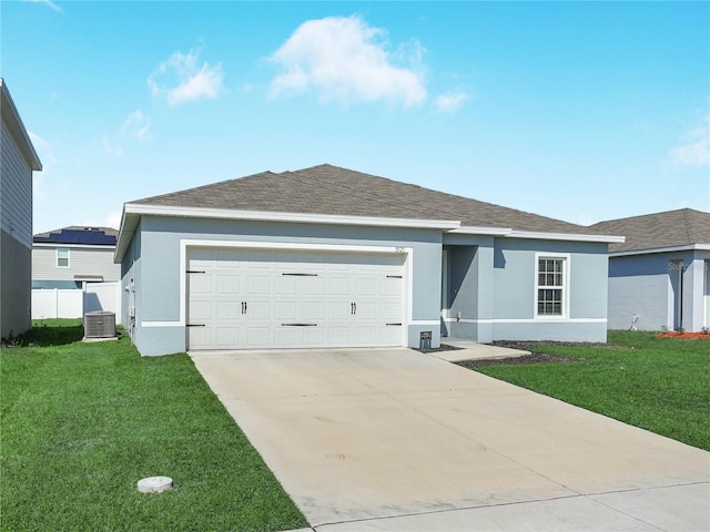 single story home featuring a garage, central AC, and a front yard