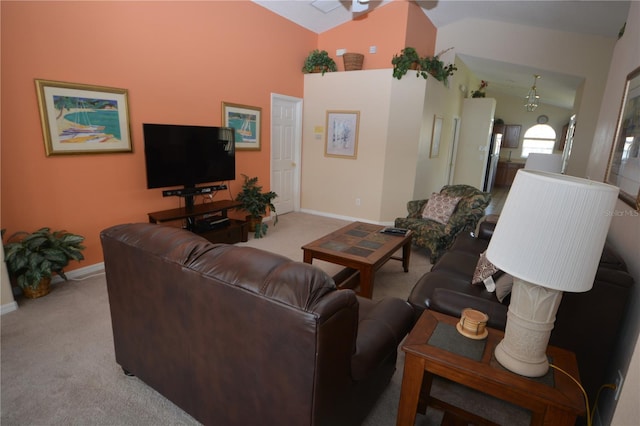 carpeted living room with vaulted ceiling