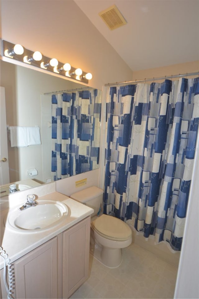 full bathroom with tile patterned floors, vanity, toilet, and shower / tub combo