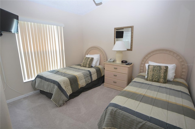 bedroom featuring light colored carpet