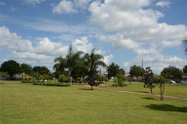 view of home's community featuring a lawn