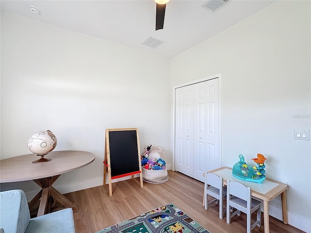 rec room featuring hardwood / wood-style flooring and ceiling fan