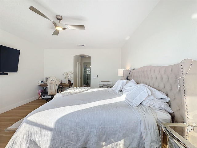 bedroom featuring wood-type flooring and ceiling fan