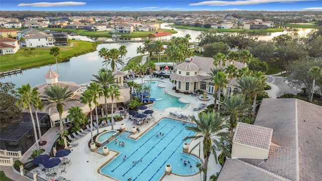 birds eye view of property with a water view